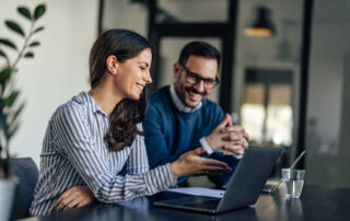 From Closing the Books to Shaping Decisions: A Senior Accountant's Playbook 9 Laughing caucasian colleagues, checking the company budget on th